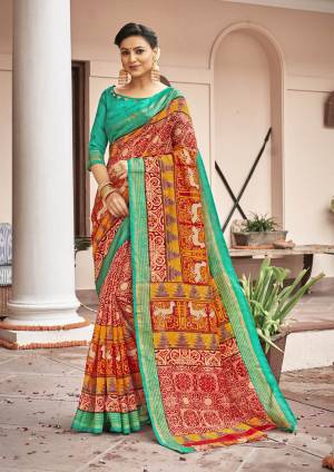 For A Proper Traditional Look, Grab This Silk Based Saree In Orange Color Paired With Contrasting Sea Green Colored Blouse. It Is Fabricated On Art Silk Eith Multiple Prints All Over.