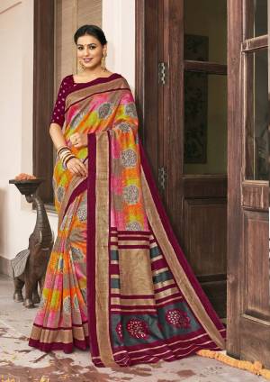 Go Colorful With This Multi Colored Saree Paired With Contrasting Maroon Colored Blouse. This Saree And Blouse Are Silk Based Fabric Beautified With Prints All Over. 