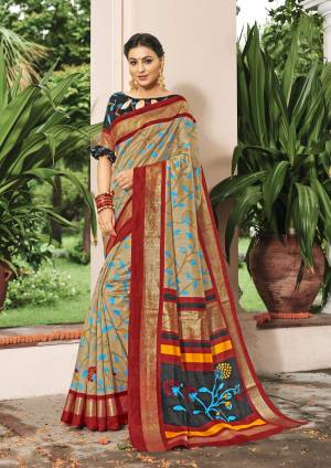 Flaunt Your Rich And Elegant Taste Wearing This Saree In Beige And Red Color Paired With Black Colored Blouse. This Saree And Blouse are Art Silk Based Fabric Beautified With Prints all Over.