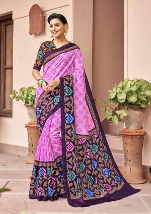 A Very Pretty Combination Is Here With This Silk Based Saree In Pink And Purple Color Paired With Purple Colored Blouse. This Saree And Blouse Ensures Superb Comfort All Day Long.