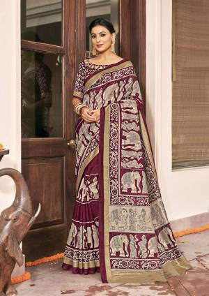 You Will Earn Lots Of Compliments Wearing This Silk Based Saree In Maroon And Grey Color Paired With Maroon Colored Blouse. Its Fabric And Color Gives A Rich Look To Your Personality.