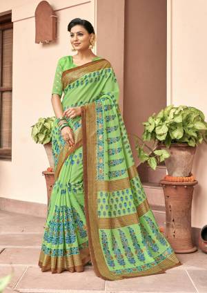 This Festive Season Have A Rich And Elegant Look Wearing This Saree In Green Color Paired With Green Colored Blouse. This Saree And Blouse Are Fabricated On Art Silk Beautified With Bold Prints All Over.