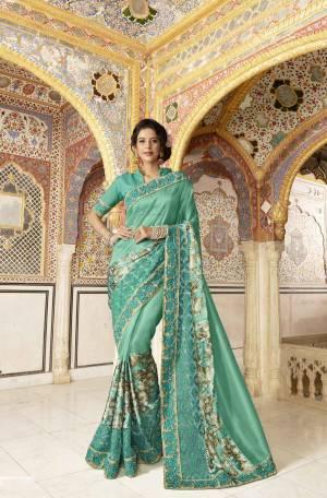 Grab This Pretty Designer Saree In Sea Green Color Paired With Sea Green Colored Blouse. This Saree Is Fabricated On Fancy Silk Paired With Art Silk Fabricated Blouse. Its Fabric And Work Gives A Rich Look To Your Personality. Buy Now.
