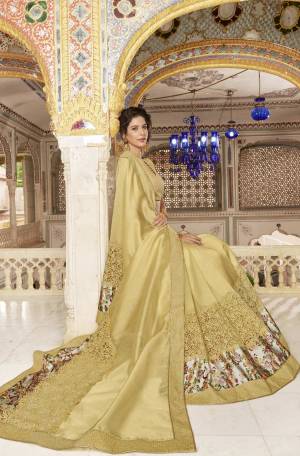 Simple And Elegant Looking Designer Saree Is Here In Beige Color Paired With Beige Colored Blouse. This Saree Is Silk based Fabric Beautified With Floral Prints And Attractive Embroidery. Buy This Saree Now.