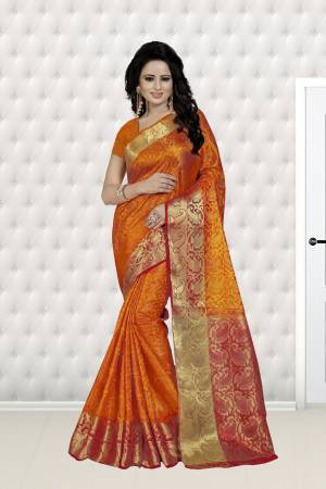 Celebrate this Festive Season Wearing This Attractive Saree In Orange Color Paired With orange Colored Blouse. This Saree And Blouse Are Fabricated On Banarasi Art Silk Beautified With Weave all Over. Buy Now.