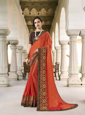 Get Ready For The Upcoming Festive Season With This Designer Saree In Orange Color Paired With Contrasting Brown Colored Blouse. This Saree Is Fabricated on Silk Georgette Paired With Art Silk Fabricated Blouse. Buy This Designer Saree Now.
