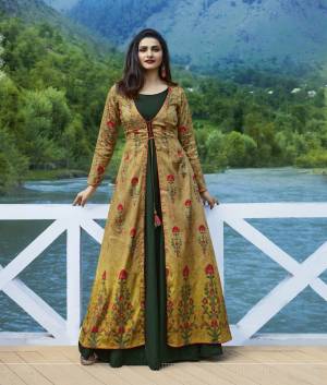 Grab This Designer Readymade Kurti Cum Gown To Your Wardrobe In  Dark Green And Yellow Color Fabricated On Satin And Silk Beautified With Prints All Over The Jacket. Its Attractive Color Combination And Fabric Will earn You Lots Of Compliments From Onlookers.