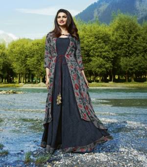 Flaunt Your Rich And Elegant Taste Wearing This Designer Readymade Kurti Cum Gown With Jacket. This Grey Colored Designer Dress Is Fabricated On Satin And Crepe Beautified With Prints All Over The Jacket. Buy This Dress Now.