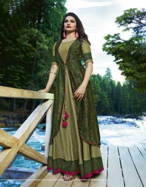 Look Pretty In This Designer Kurti Cum Gown In Green Color. It Is Fabricated On Satin And Crepe Beautified With Samll Prints. Its Fabric Is Soft Towards Skin And Easy To Carry all Day Long. Buy Now.