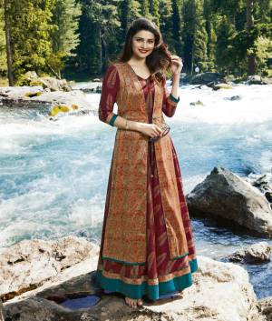 Add This Beautiful Designer Kurti Cum Gown In Maroon And Orange Color Fabricated On Silk. This Readymade Dress Is Available In All Regular Sizes. Its Fabric Is Soft Towards Skin And Easy To Carry All Day Long.