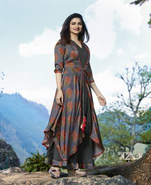 Flaunt Your Rich And Elegant Taste Wearing This Designer Readymade Kurti Cum Gown With Jacket. This Grey Colored Designer Dress Is Fabricated On Satin And Crepe Beautified With Prints All Over The Jacket. Buy This Dress Now.