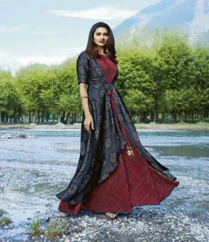 You Will Definitely Earn Lots Of Compliments Wearing This Designer Readymade Kurti Cum Gown In Maroon And Blue Color Fabricated On Satin And Crepe. Its Fabrics Ensures Superb Comfort All Day Long. Buy Now.