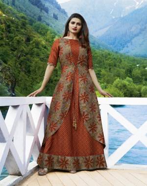 Buy This Beautifiul Designer Readymade Gown Cum Kurti In Rust Orange And Grey Color Fabricated On Silk. It Silk Fabric And Prints Will Give A Rich Look To Your Personality. Buy Now.