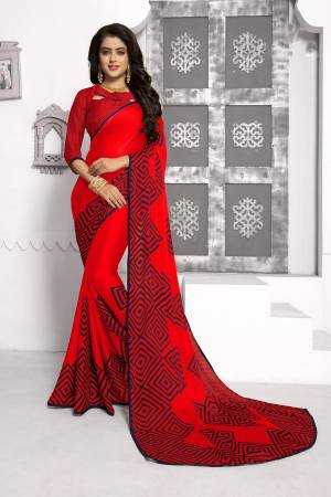 Adorn The Pretty Angelic Look Wearing This Red Colored Saree Paired With Red Colored Blouse. This Saree And Blouse Are Fabricated On Chiffon Beautified With Simple Prints. It Is Light Weight And easy To Carry All Day Long.