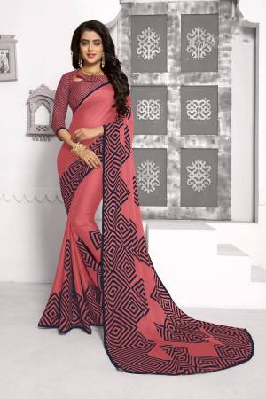 Look Pretty Wearing This Simple And Elegant Looking Saree In Pink Color Paired With Pink Colored Blouse. This Saree And Blouse Are Fabricated On Chiffon Beautufied With Prints. Buy Now.