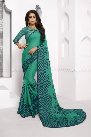For Your Casual Or Semi-Casual Wear, Grab This Pretty Saree In Sea Green Color Paired With Sea Green Colored Blouse. This Saree And Blouse Are Chiffon Based Fabric Beautified With Simple Prints. Buy Now.
