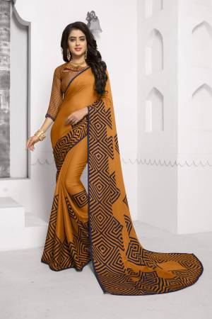 Celebrate This Festive Season Wearing This Pretty Saree In Musturd Yellow Color Paired With Musturd Yellow Colored Blouse. This Saree And Blouse Are Fabricated On Chiffon Beautified Simple Prints All Over. Buy This Saree Now.