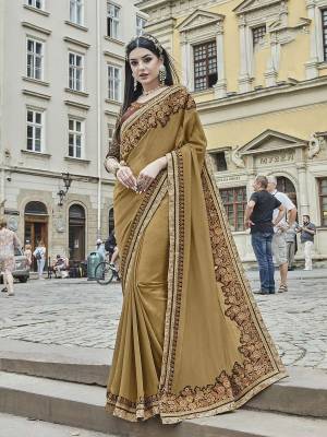 Rich And Elegant Looking Designer Saree Is Here In Beige Color Paired With Contrasting Brown Colored Blouse. This Saree Is Fabricated On Silk Chiffon Paired With Art Silk Fabricated Blouse. Buy This Designer Saree With Rich Combination. Buy Now.