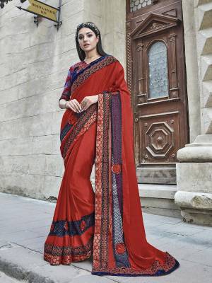 Adorn The Pretty Angelic look Wearing This Designer Saree In Red Color Paired With Contrasting Royal Blue Color Blouse. This Saree Is Silk Based Fabricated Paired With Velvet And Net Fabricated Blouse. Buy This Saree Now.
