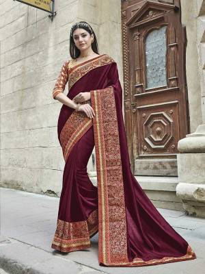 New Shade Is Here To Add Up Into Your Wardrobe In Wine Color Paired With Beige Colored Blouse. This Saree Silk Based Paired With Art Silk fabricated Blouse. This Saree Is Easy To Drape And Carry All Day Long.