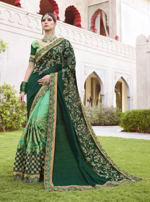 Go With The Shades Of Green With This Designer Saree In Dark Green And Green Color Paired With Green Colored Blouse. This Saree And Blouse Are Silk Based Beautified With Heavy Embroidery.
