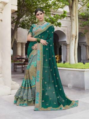 Unique Color Combination Is Here With This Designer Saree In Teal Green And Grey Color Paired With Grey Colored Blouse. This Saree And Blouse Are Art Silk Based Beautified With Heavy Work. Buy Now.