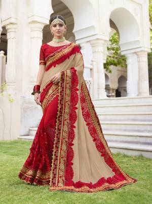 Evergreen Combination Is Here With This Designer Saree In Beige And Red Color Paired With Red Colored Blouse. This Saree Is Fabricated On Georgette Paired With Art Silk Fabricated Blouse. It Has Heavy Embroidery All Over It. Buy Now.
