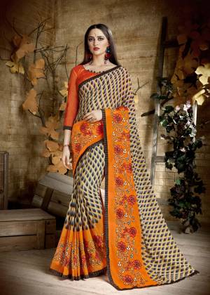 For Your Casual wear, Grab This Saree In Multi And Orange Color Paired With Orange Colored Blouse. This Saree Is Fabricated On Georgette Paired With Art Silk Fabricated Blouse. It Is Beautified With Prints And Thread Work Which IS Perfect For Casual Or Semi-Casuals.