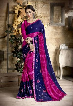 Grab This Lovely Saree In Navy Blue And Dark Pink Color Paired With Dark Pink Colored Blouse. This Saree Is Georgette Based Paired With Art Silk Fabricated Blouse. This Saree Is Beautified With Prints And Thread Work. Buy This Saree Now.