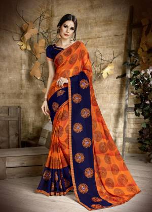 Orange Color Induces Perfect Summery Appeal To Any Outfit, Grab This Saree In Orange Color Paired With Contrasting Navy Blue Colored Blouse. This Georgette Based Saree Ensures Superb Comfort All Day Long. Buy Now.