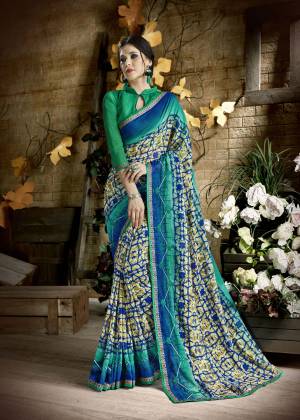 For Your Casual wear, Grab This Saree In Multi Color Paired With Sea Green Colored Blouse. This Saree Is Fabricated On Georgette Paired With Art Silk Fabricated Blouse. It Is Beautified With Prints And Thread Work Which IS Perfect For Casual Or Semi-Casuals.