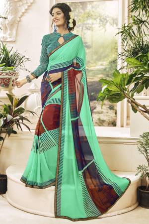 Grab This Beautiful Saree For Your Casual Wear In Sea Green Color Paired With Sea Green Colored Blouse. This Saree And Blouse Are Fabricated On Georgette Beautified With Prints. It Is Light Weight And Durable.