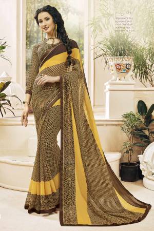 Elegant Looking Saree For Your Casual Wear Is Here In Yellow And Brown Color Paired With Brown Colored Blouse. This Saree And Blouse Blouse Are Fabricated On Georgette Beautified With Prints all Over It. This Saree Is Easy To Drape And Carry All Day Long.