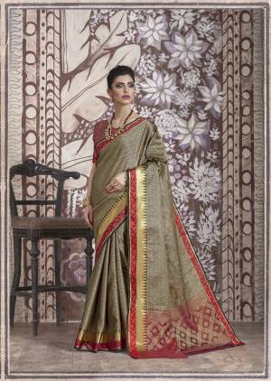 Flaunt Your Rich and Elegant Taste Wearing This Designer Silk Saree In Grey Color Paired With Contrasting Red Colored Blouse. This Saree And Blouse are Banarasi Muslin Silk Fabricated Which Gives A Rich Look To Your Personality.