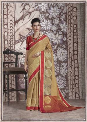 Simple And Elegant Looking Designer Saree Is Here In Beige Color Paired With Contrasting Red Colored Blouse. This Saree And Blouse Are Banarasi Muslin Silk Based Fabric. It Is Light Weight , Easy To Drape And Also Durable.