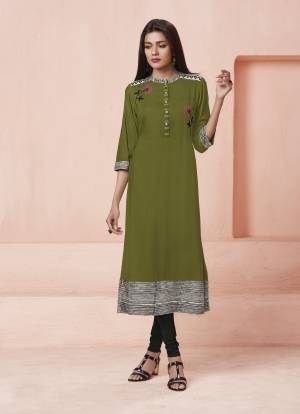 Add This Lovely Shade To Your Wardrobe With This Designer Readymade Kurti In Olive Green Color Fabricated On Rayon. It Is Beautified With Multi Colored Thread Work. Buy This Readymade Kurti Now.