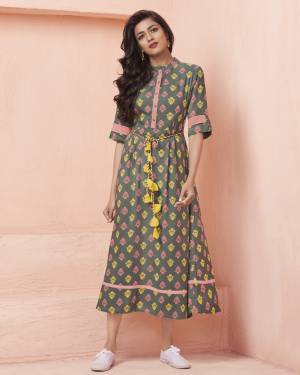 You Will Definitely Earn Lots Of Compliments Wearing This Designer Readymade Kurti In Grey Color Fabricated On Rayon Beautified With Attractive Yellow And Pink Colored Small Prints. This Kurti Is Light In Weight And Easy To Carry All Day Long. 