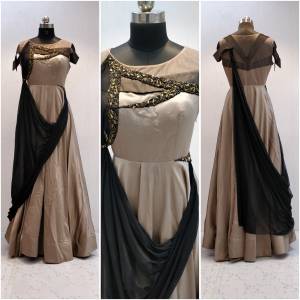 Grab This Designer Readymade Gown For The Upcoming Occasion At Your Place With This Lovely Beige And Black Colored Gown Fabricated On Velevt Satin And Georgette Beautified with Hand Work. This Designer Lehenga Has Unique Drape Pattern Which Will Earn You Lots Of Compliments From Onlookers.