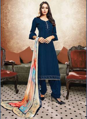 Enhance Your Beauty Wearing This Suit In Navy Blue Color Paired With Multi Colored Dupatta. Its Top And Bottom Are Satin Based Fabric Paired With Chiffon Dupatta. Get This Dress Material Stitched As Per Your Desired Fit And Comfort. Buy Now.