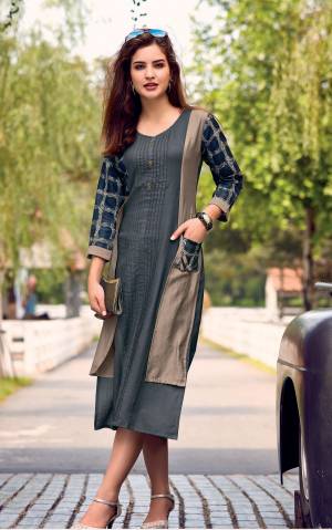 For A Rich And Elegant Look, Grab This Designer Readymade Kurti In Dark Grey Color Fabricated On Cotton Satin. This Fabric Is Soft Towards Skin And Easy To Carry All Day Long. Buy Now.
