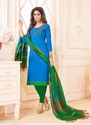 Add This Bright Shade To Your Wardrobe With This Dress Material In Blue Color Paired With Contrasting Green Colored Bottom And Dupatta. This Dress Material Is Cotton Based Paired With Banarasi Dupatta. Buy This Now.