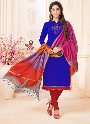 Add This Bright Shade To Your Wardrobe With This Dress Material In Royal Blue Color Paired With Contrasting Red Colored Bottom And Dupatta. This Dress Material Is Cotton Based Paired With Banarasi Dupatta. Buy This Now.