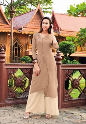 Simple And Elegant Looking Designer Readymade Kurti Is Here In Beige Color Fabricated On Silk Cotton With Asymetric Pattern. This Readymade Kurti Is Available In All Regular Sizes. 