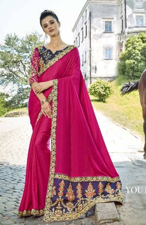 Shine Bright Wearing This Heavy Designer Saree In Dark Pink Color Paired With Contrasting Navy Blue Colored Blouse,. This Saree Is Fabricated On Satin Silk Paired With Art Silk Fabricated Blouse. Both The Attractive Colors Will Earn You Lots Of Compliments From Onlookers.