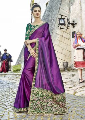 Catch All The Limelight Draping This Beautiful Designer Saree In Purple Color Paired With Contrasting Green Colored Blouse. This Saree Is Fabricated On Satin Silk Paired With Art Silk Fabricated Blouse. Buy This Saree Now.