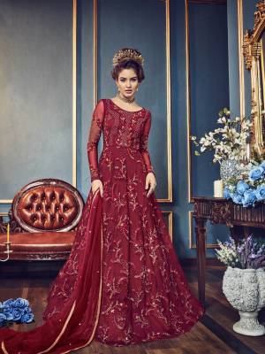 For A Royal Queen Look, Grab This Heavy Designer Floor Length Suit In Maroon Color Paired With Maroon Colored Bottom And dupatta. Its Top And Dupatta Are Fabricated Paired With Santoon Bottom. This Suit Is Comfortable To Carry Throughout The Gala.