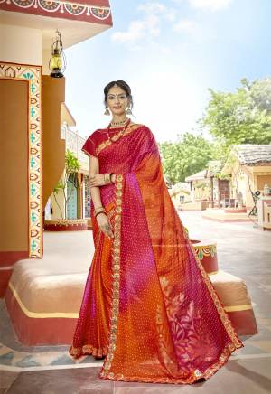 Orange And Red Color Induces Perfect Summery Appeal To Any Outfit, So Grab This Saree In Orange And Red Color Paired With Red Colored Blouse. This Saree IS fabricated On Geotrgette Paired With Art Silk Fabricated Blouse. Buy This Saree Now.
