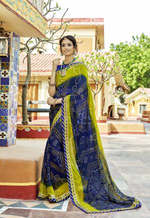 Enhance Your Beauty Wearing This Bandhej Saree In Navy Blue And Green Color Paired With Navy Blue Colored Blouse. This Saree Is Fabricated On Georgette Paired With Art Silk Fabricated Blouse. Buy This Saree Now.