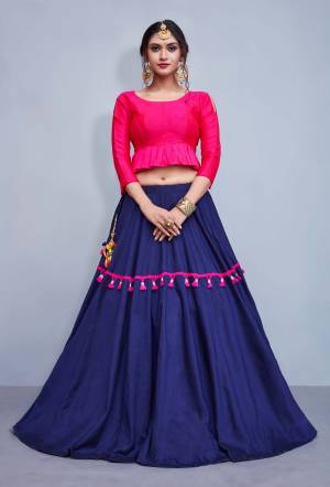 This Festive Season, Be The Most Trendy Of All With This Designer Skirt And Peplum Top. Its Blouse Is In Dark Pink Color Paired With Navy Blue Lehenga. Its Blouse Is Fabricated On Art Silk Where Its Skirt Is Cotton Based. Buy Now.