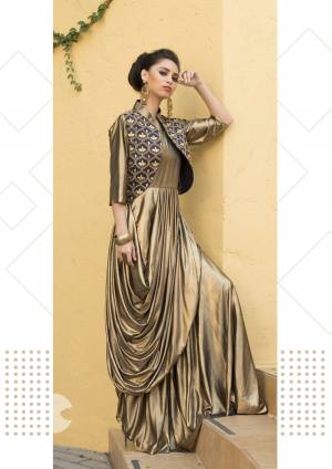 Look Attractive In This Golden Colored Readymade Gown Fabricated On Lycra. It Is Available In All Regular Sizes With Embroidered Jacket.